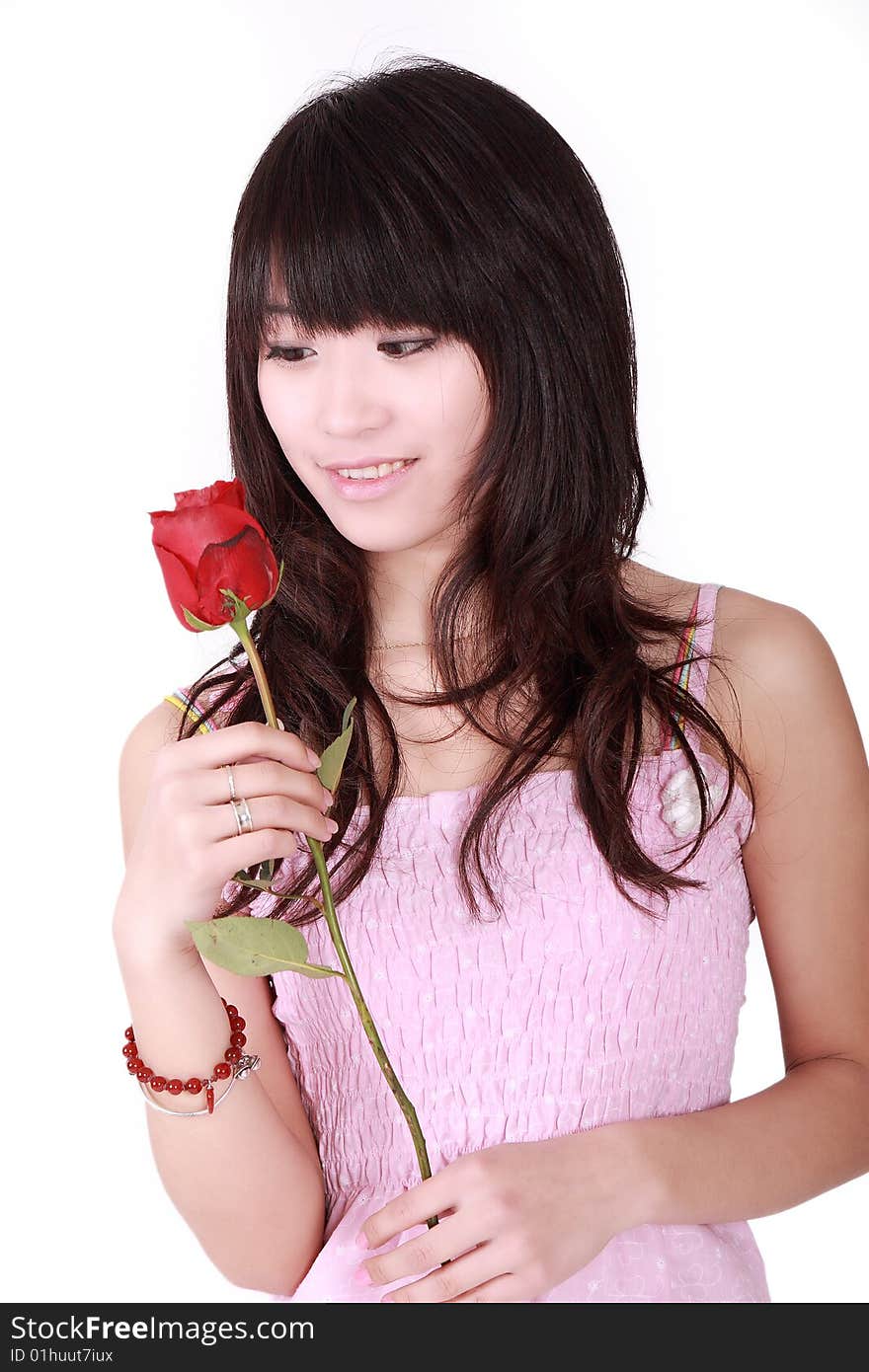 A beautiful Asian girl  holds a red rose on white background. A beautiful Asian girl  holds a red rose on white background.