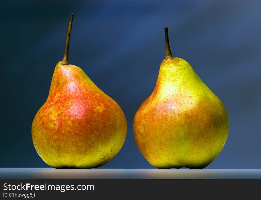 Two pears on a dark background