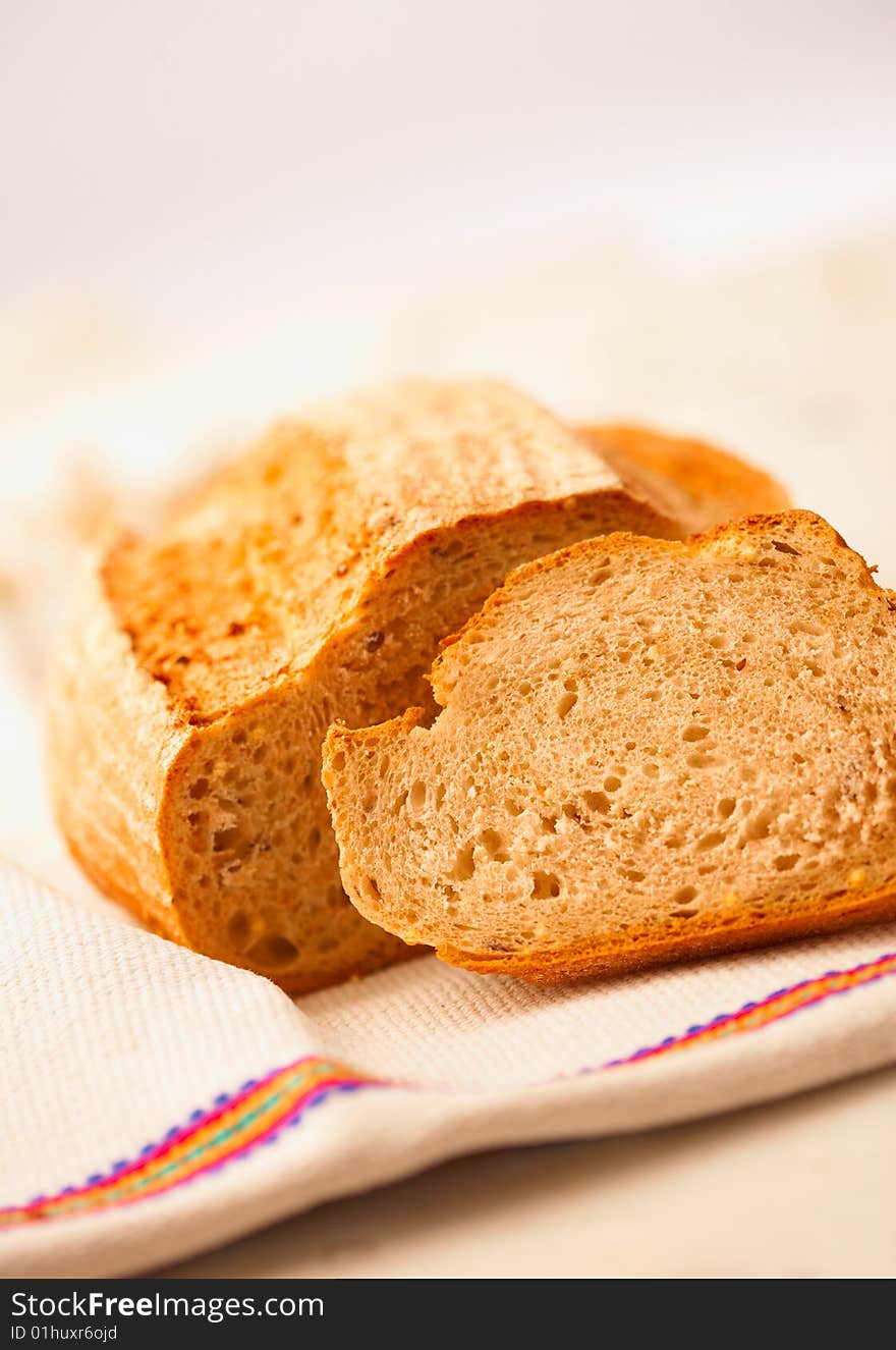 Delicious, fresh, home-made whole bread on white. Delicious, fresh, home-made whole bread on white