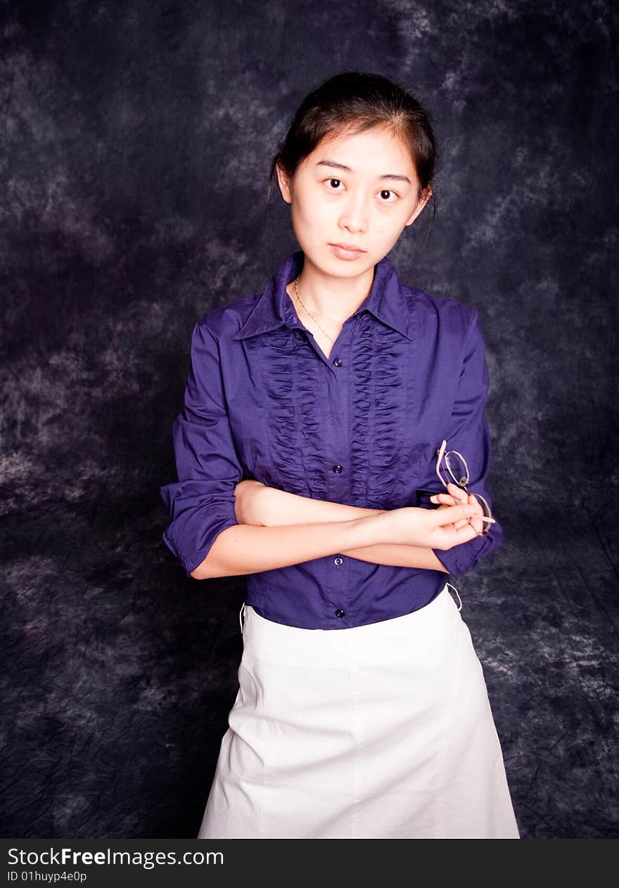 Chinese office lady in purple shirt and white skirt