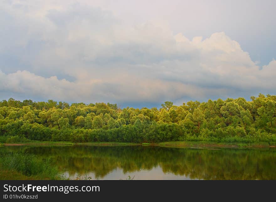 Cloudscape landscape on summer river. Cloudscape landscape on summer river