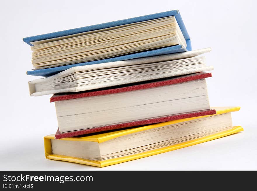 Isolated books stack on the desk