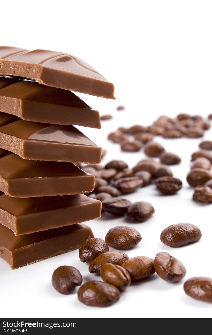 Chocolate and coffee beans on white background