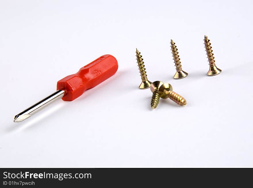 Isolated screwdriver with some screws. Isolated screwdriver with some screws.