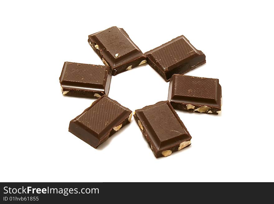 Six segments of chocolate on a white background