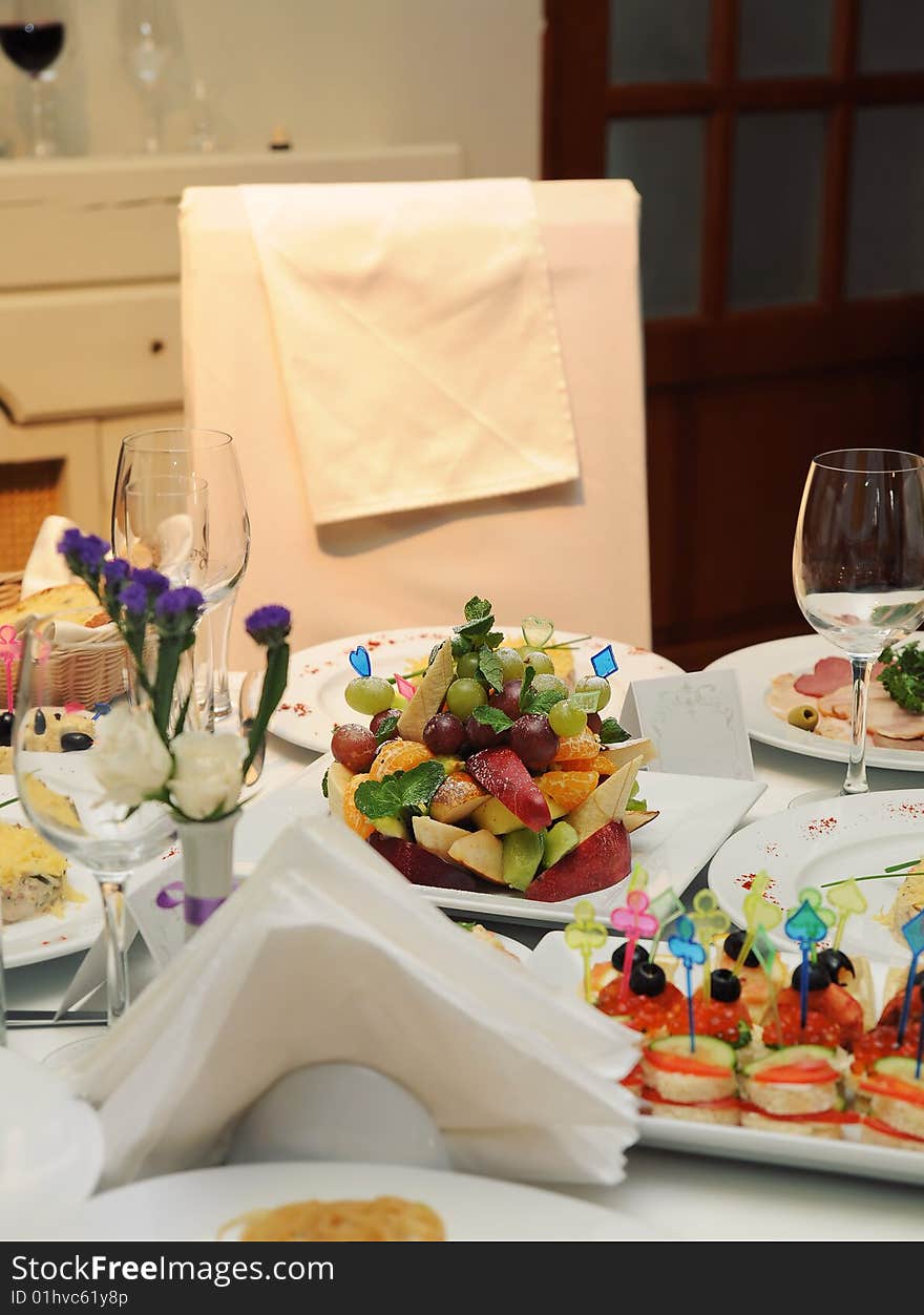 Wedding table and empty chair with decoration in fine restaurant with food served in plates. Wedding table and empty chair with decoration in fine restaurant with food served in plates