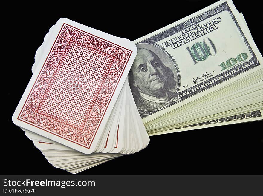 Dollars and playing cards close up