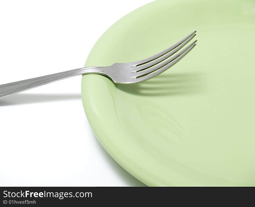 plate and fork isolated on white background