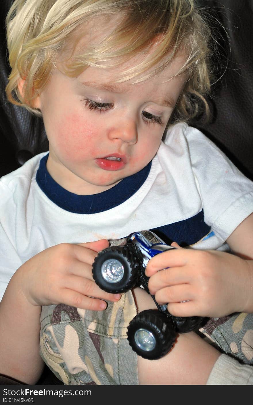 Boy Playing With Car