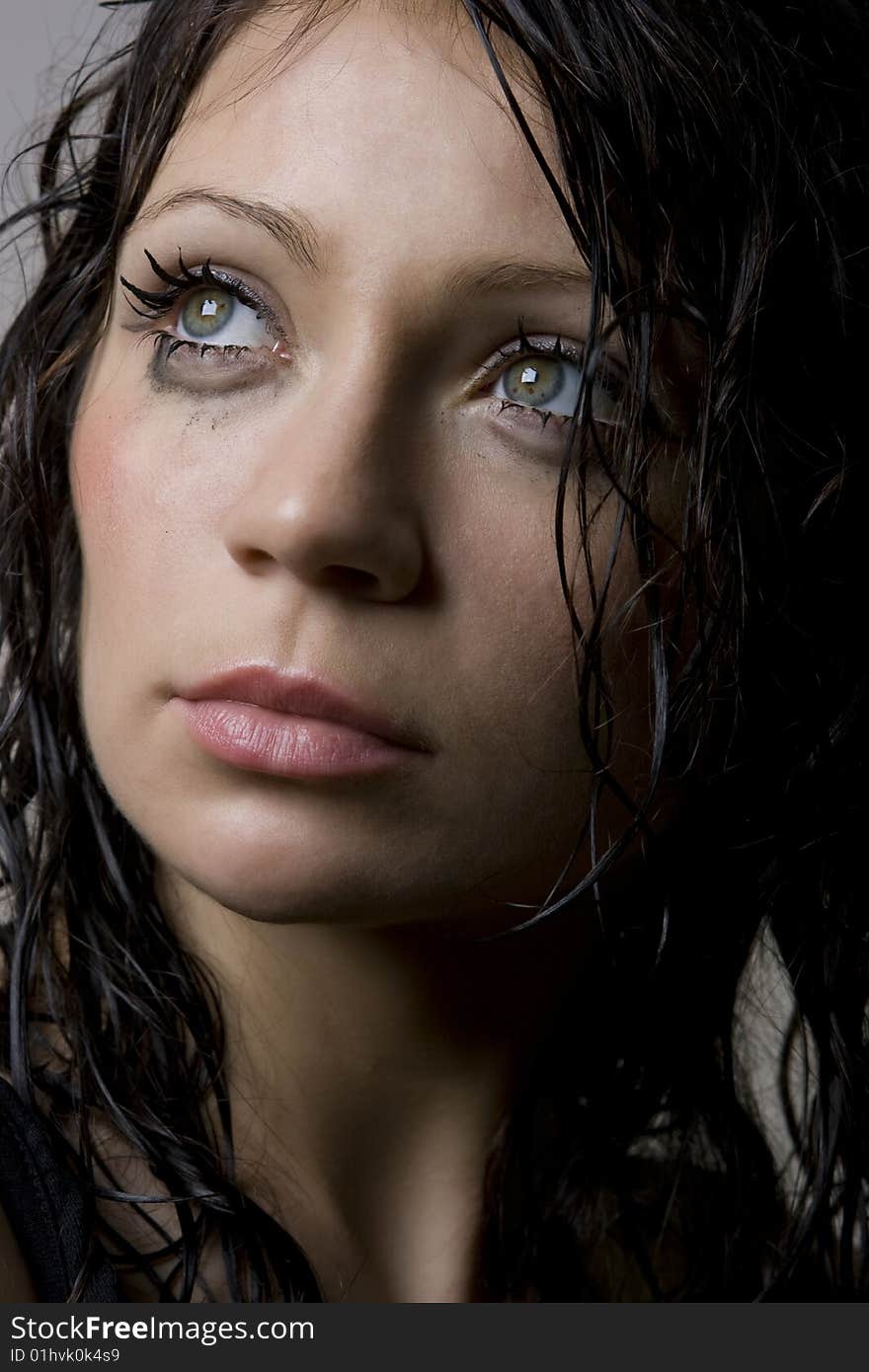 Close-up portrait of beautiful wet brunette