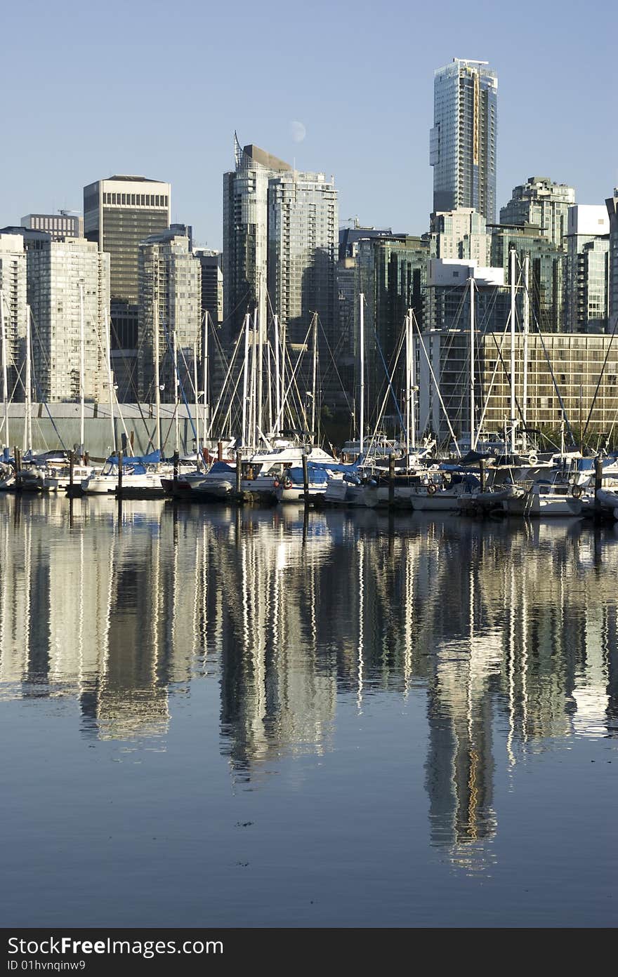 Boats are moored at a harbor in downtown Vancouver, BC Canada. Boats are moored at a harbor in downtown Vancouver, BC Canada