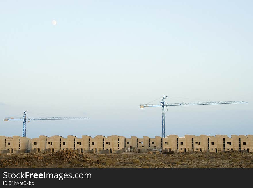 Two cranes on top of new construction. Two cranes on top of new construction