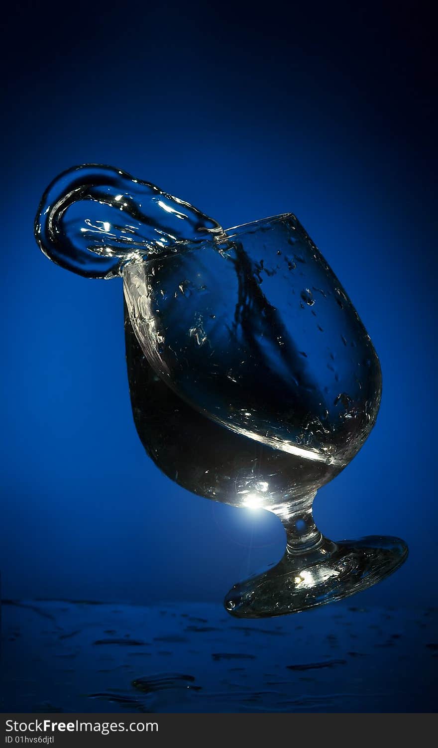 Big splash of fluid in a  glass