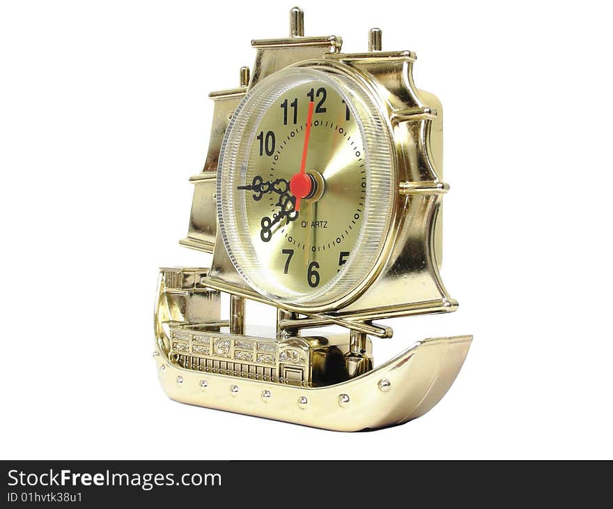 Golden ship-shaped clock on the white background. Golden ship-shaped clock on the white background