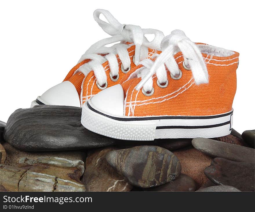 Orange sneakers , standing on stone with white lace. Orange sneakers , standing on stone with white lace