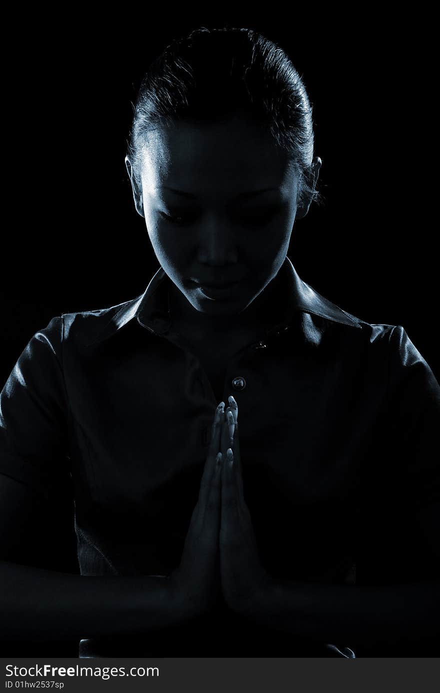 Portrait of a beautiful young woman isolated at black background