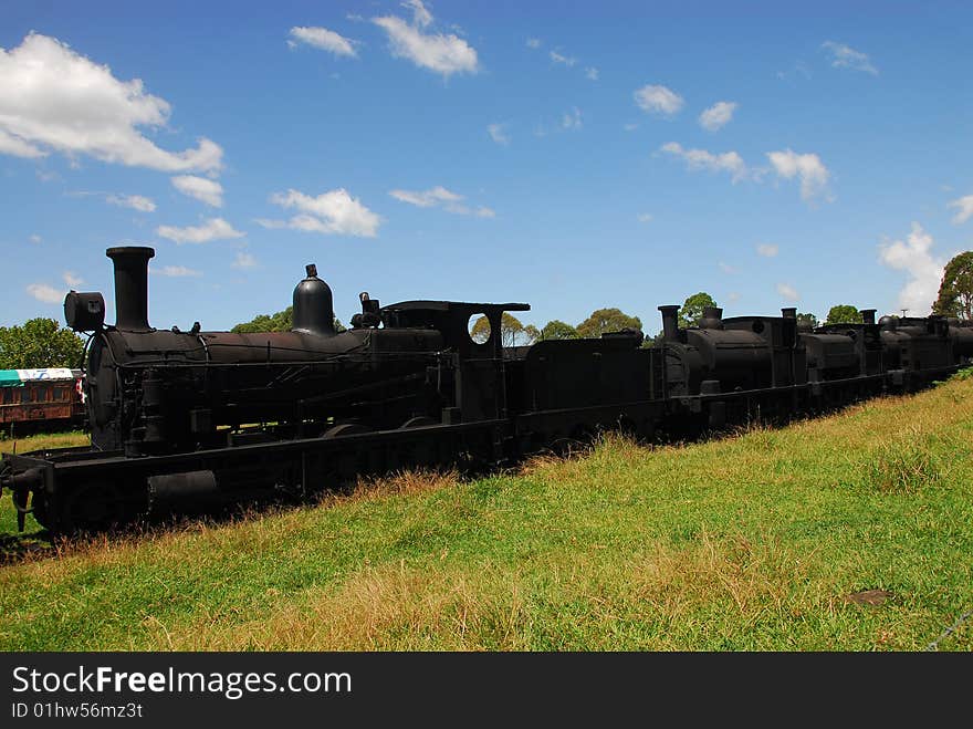 Old steam engines no longer in use linked together