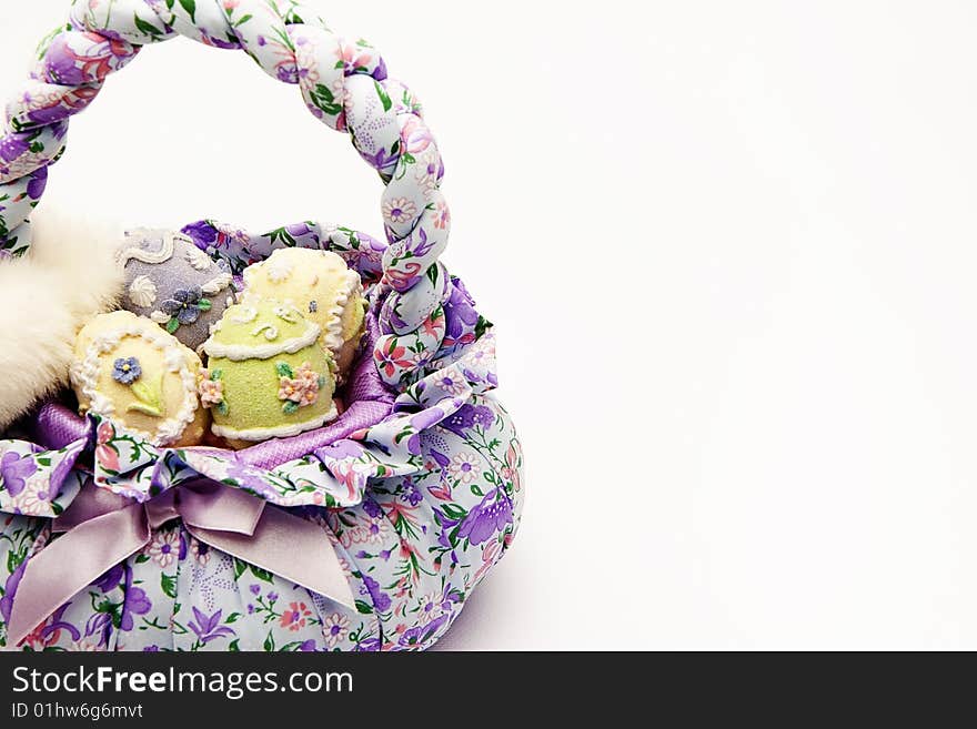 Isolated shot of a basket with easter eggs on white background. Isolated shot of a basket with easter eggs on white background.