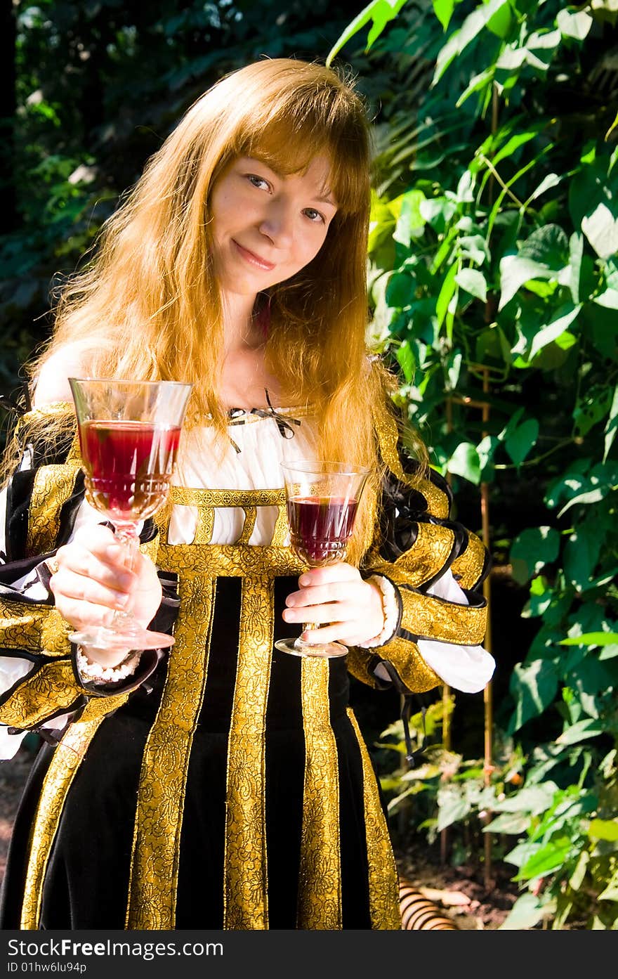 Smiling Young Woman In Renaissance Dress With Vine