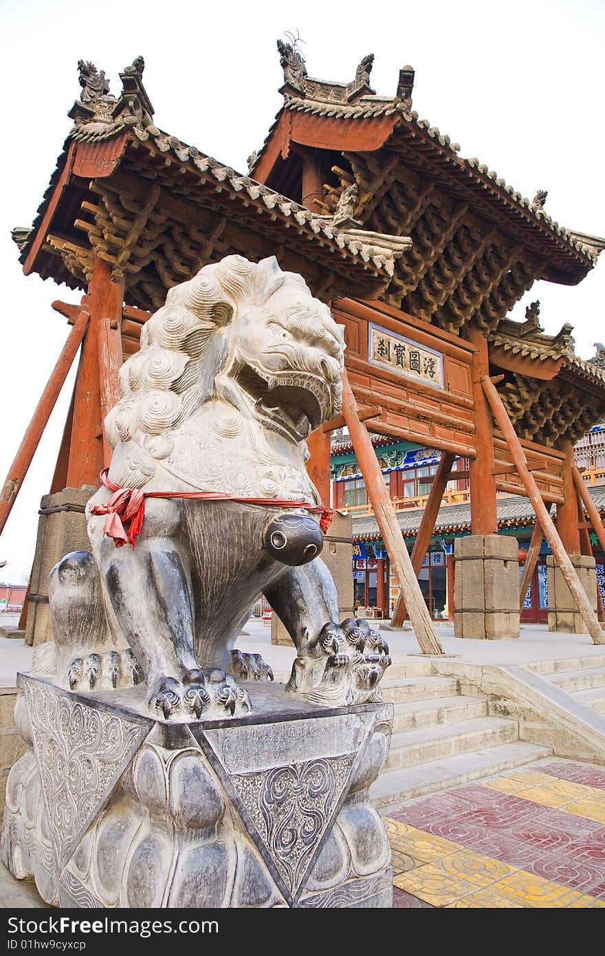 Ancient stone lions in front of building,shanxi.shanxi province of china.