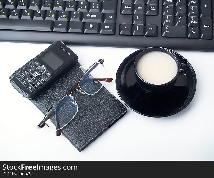 The notebook,  glasses and keyboard