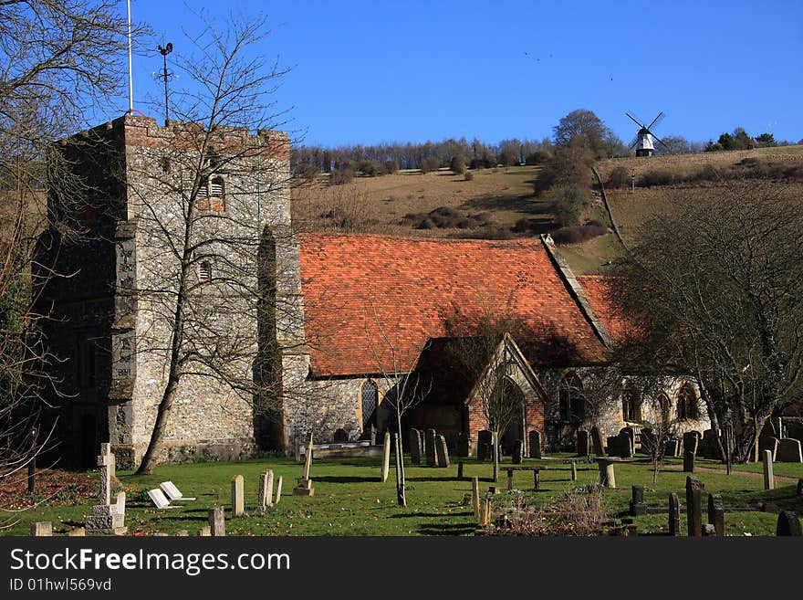 St. Mary's Church at Turville in south Buckinghamshire England. The windmill in the background was featured in the film 'Chitty Chitty Bang Bang'. St. Mary's Church at Turville in south Buckinghamshire England. The windmill in the background was featured in the film 'Chitty Chitty Bang Bang'.