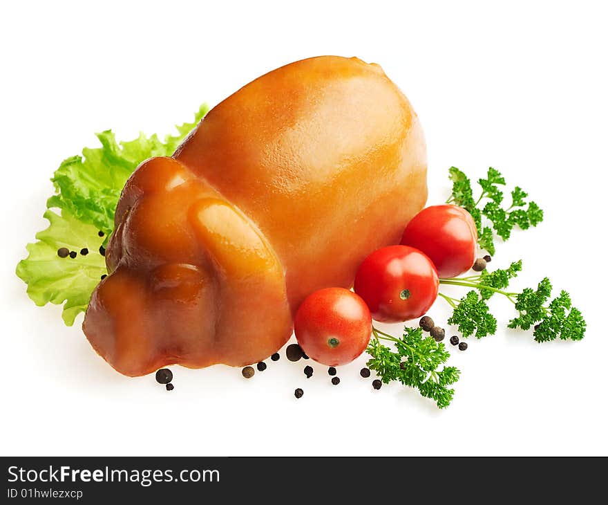 Pressed ham decorated with salad, tomato, parsley and pepper over white background