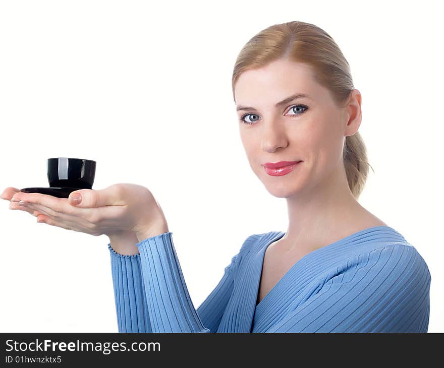 The beautiful girl with a coffee cup in a hand