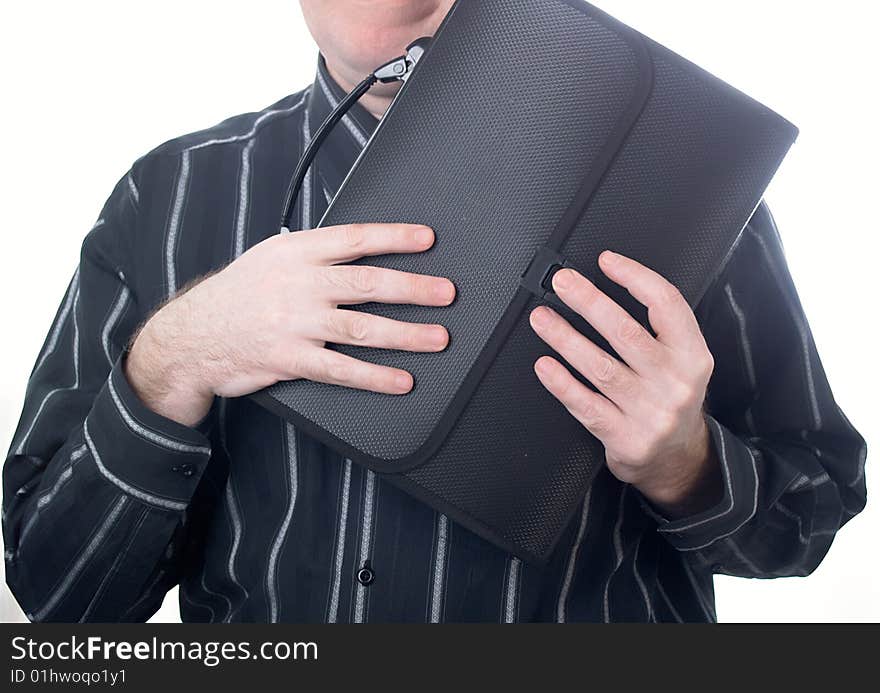 Portrait of the businessman in a dark shirt with a portfolio at office