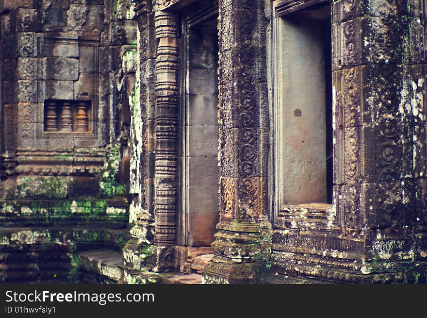 Inside view of Angkor Wat (Bayon Temple) The Bayon (Khmer language - Prasat Bayon) is a well-known and richly decorated Khmer temple at Angkor in Cambodia. Built in the late 12th century or early 13th century as the official state temple of the Mahayana Buddhist King Jayavarman VII, the Bayon stands at the centre of Jayavarman's capital, Angkor Thom.