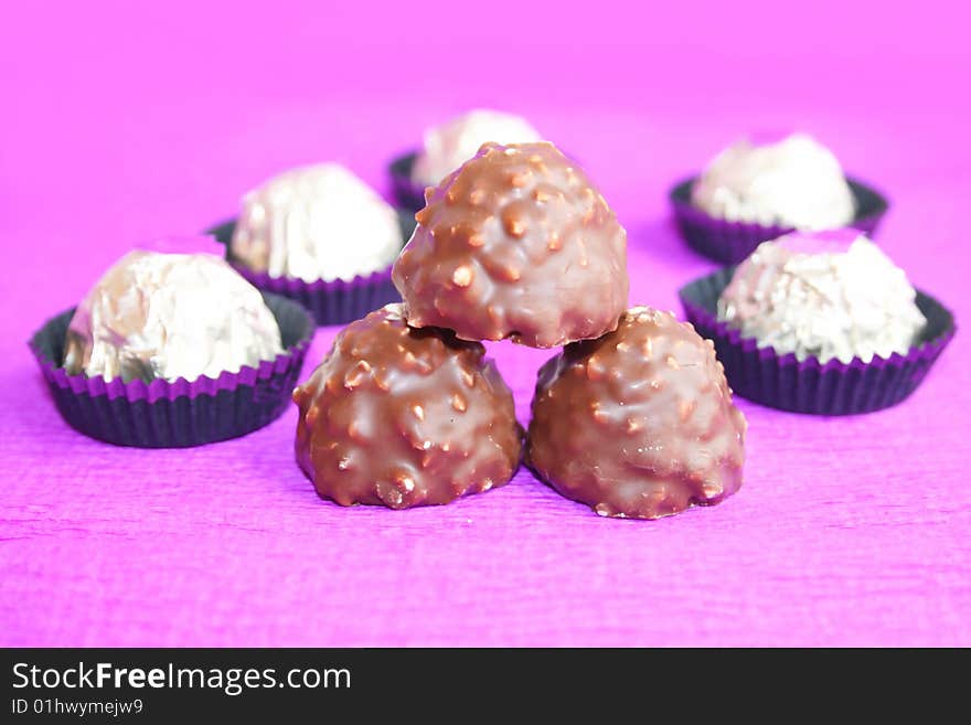 Chocolate candy on a lilac background. Chocolate candy on a lilac background