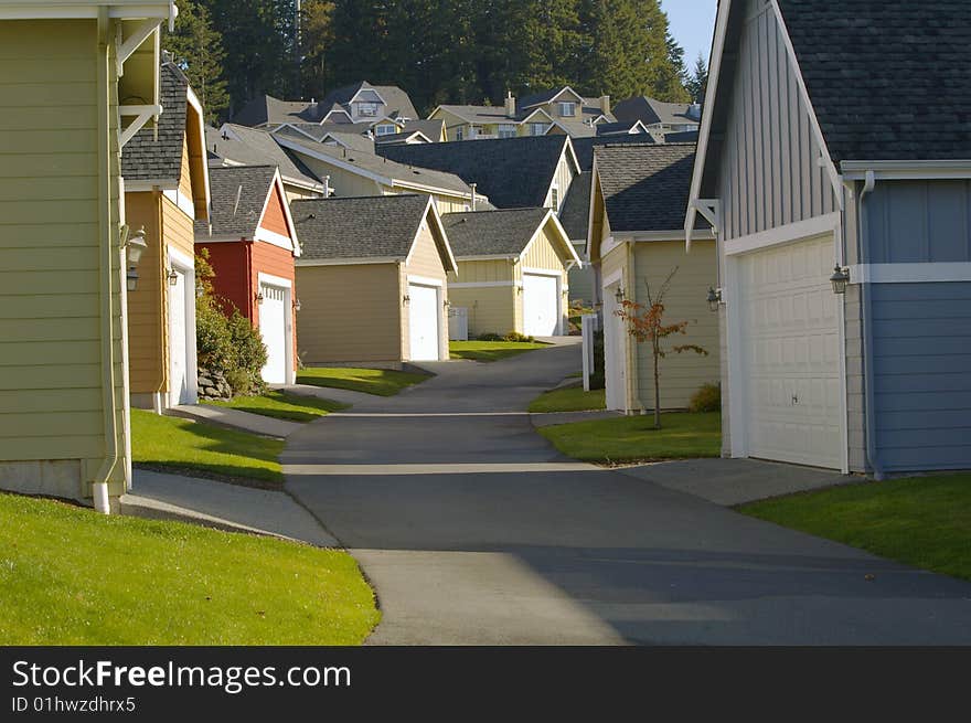 Residential neighborhood alleyway lined with colorful garages.