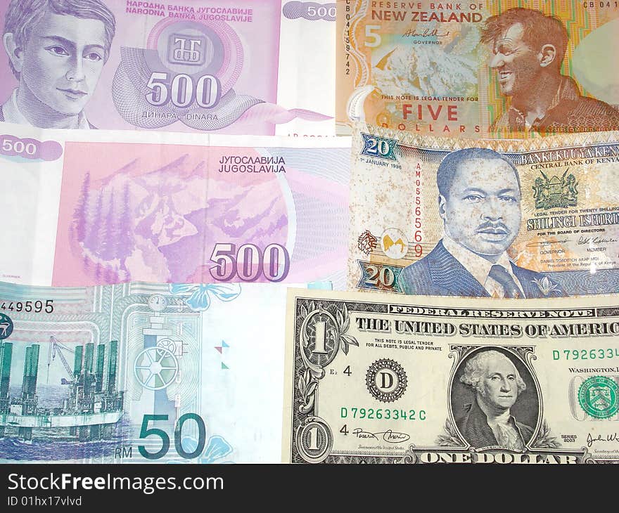 A photo of multiple country currency such as Malaysian Ringgit US Dollar New Zealand 5 Dollar Dinara 500 and Kenya's 20 shillings. A photo of multiple country currency such as Malaysian Ringgit US Dollar New Zealand 5 Dollar Dinara 500 and Kenya's 20 shillings.