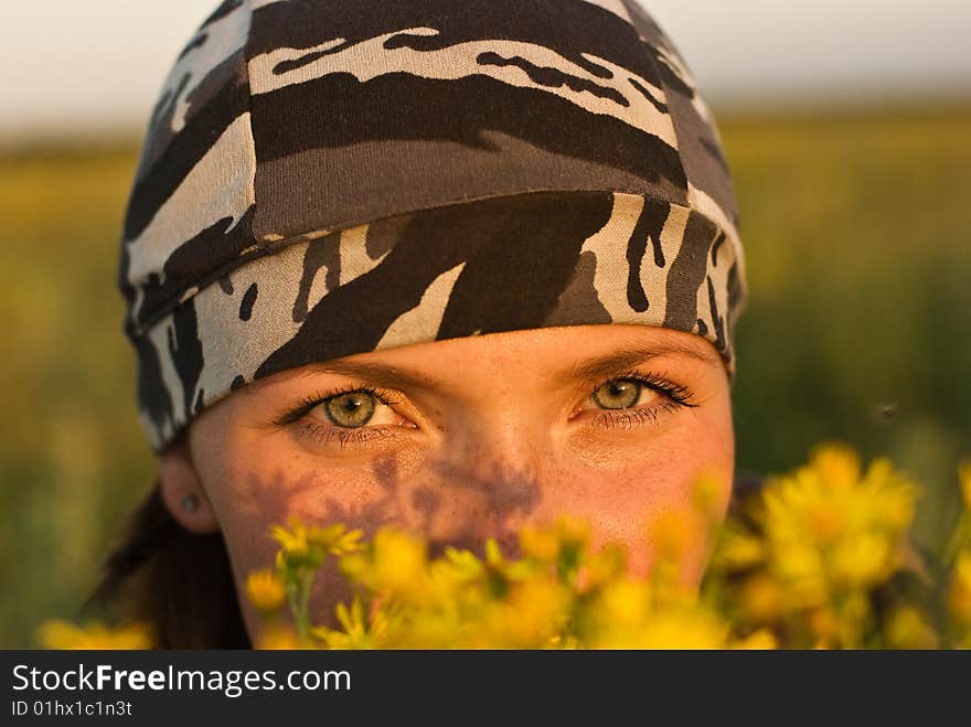 Sunset portrait of a girl on the field