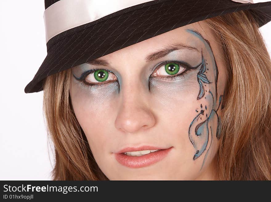 Girl close up with green eyes and black het. Girl close up with green eyes and black het