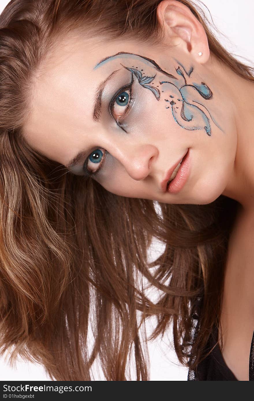 Female model with long brown hair and fantacy makeup. Female model with long brown hair and fantacy makeup