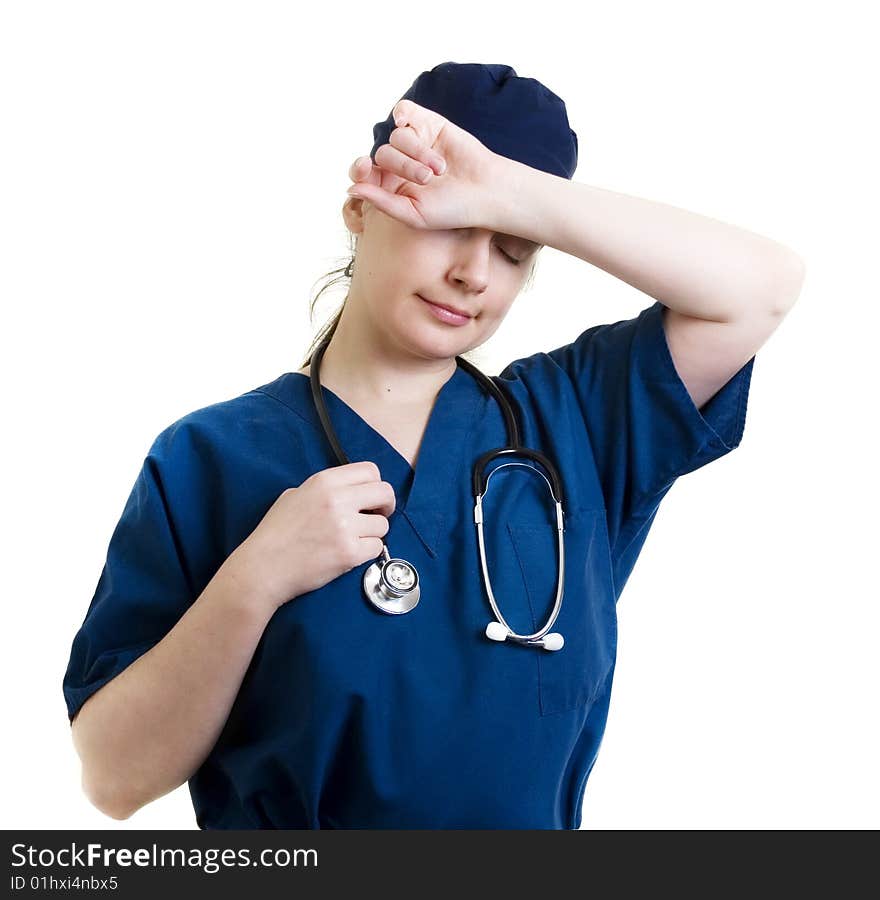 Tired female doctor in scrubs, perhaps after an exhausting surgery. Tired female doctor in scrubs, perhaps after an exhausting surgery