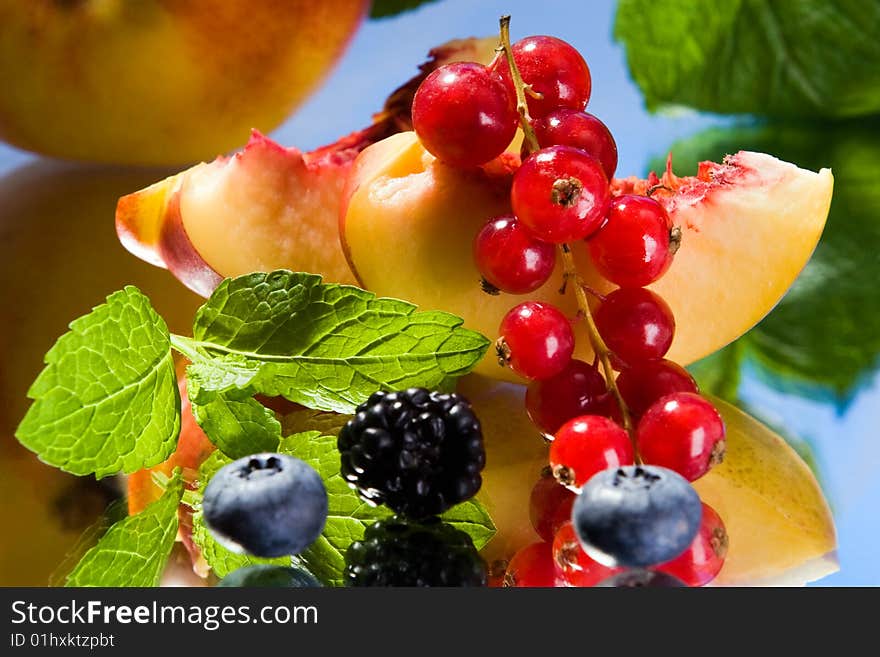 Peach, red currant, blackberry and cranberries in a group