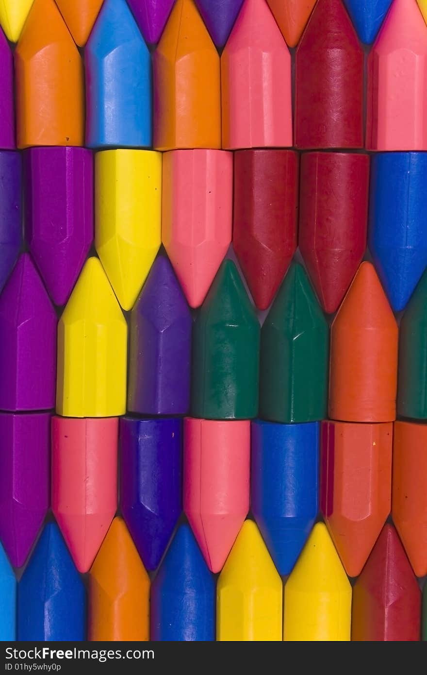 Stacked vertical rows from wax pencils, multicolors. Stacked vertical rows from wax pencils, multicolors