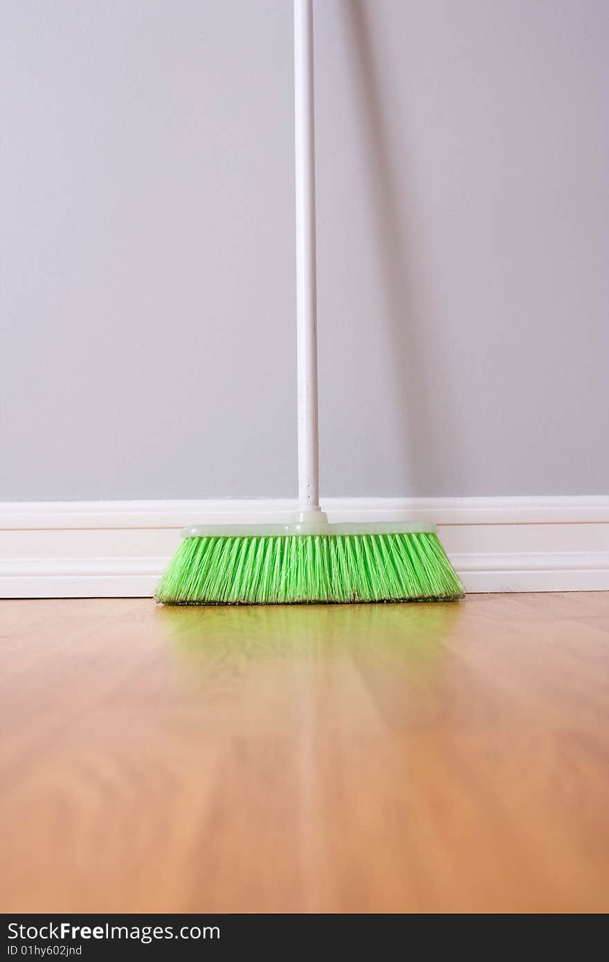 Spring Cleaning broom against wall