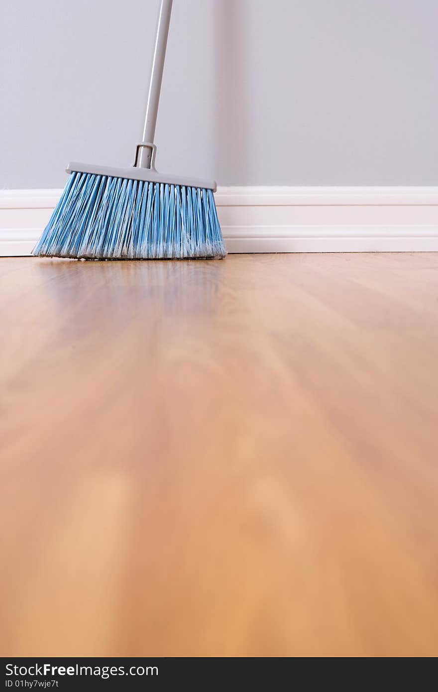 Spring Cleaning broom against wall