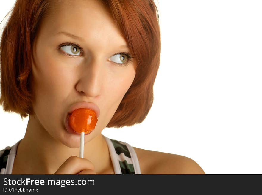 Beautiful young girl with candy on a stick