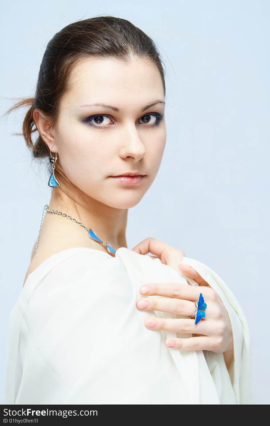 Portrait of girl in white with blue stuff