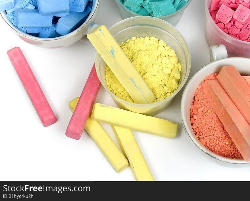 Several colors crushed chalk in tubes and caps