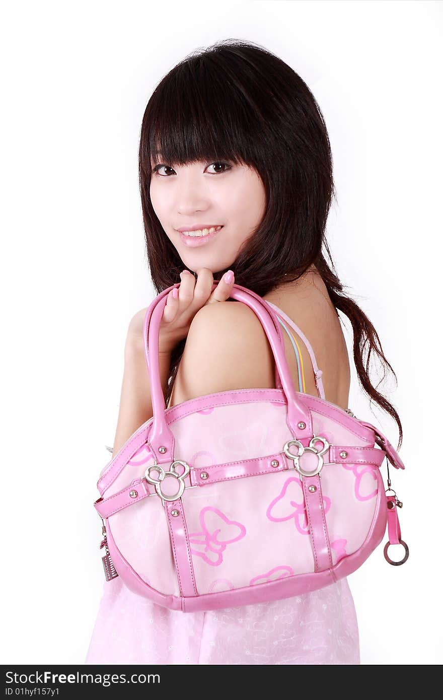 A beautiful Asian girl with pink handbag on white background.
