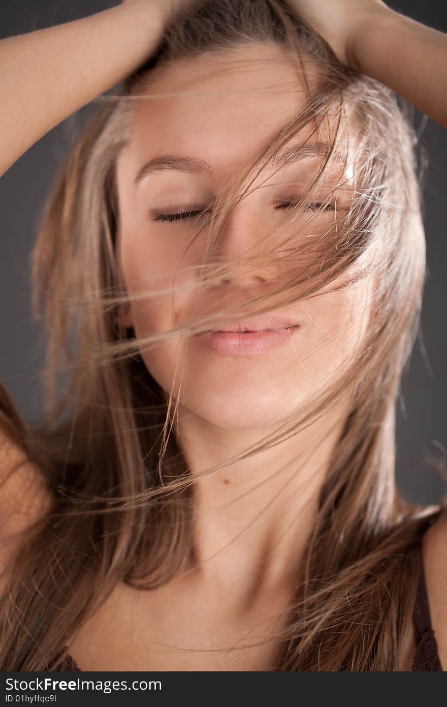 Portrait of pleasured brown-haired girl holding your hair. Portrait of pleasured brown-haired girl holding your hair