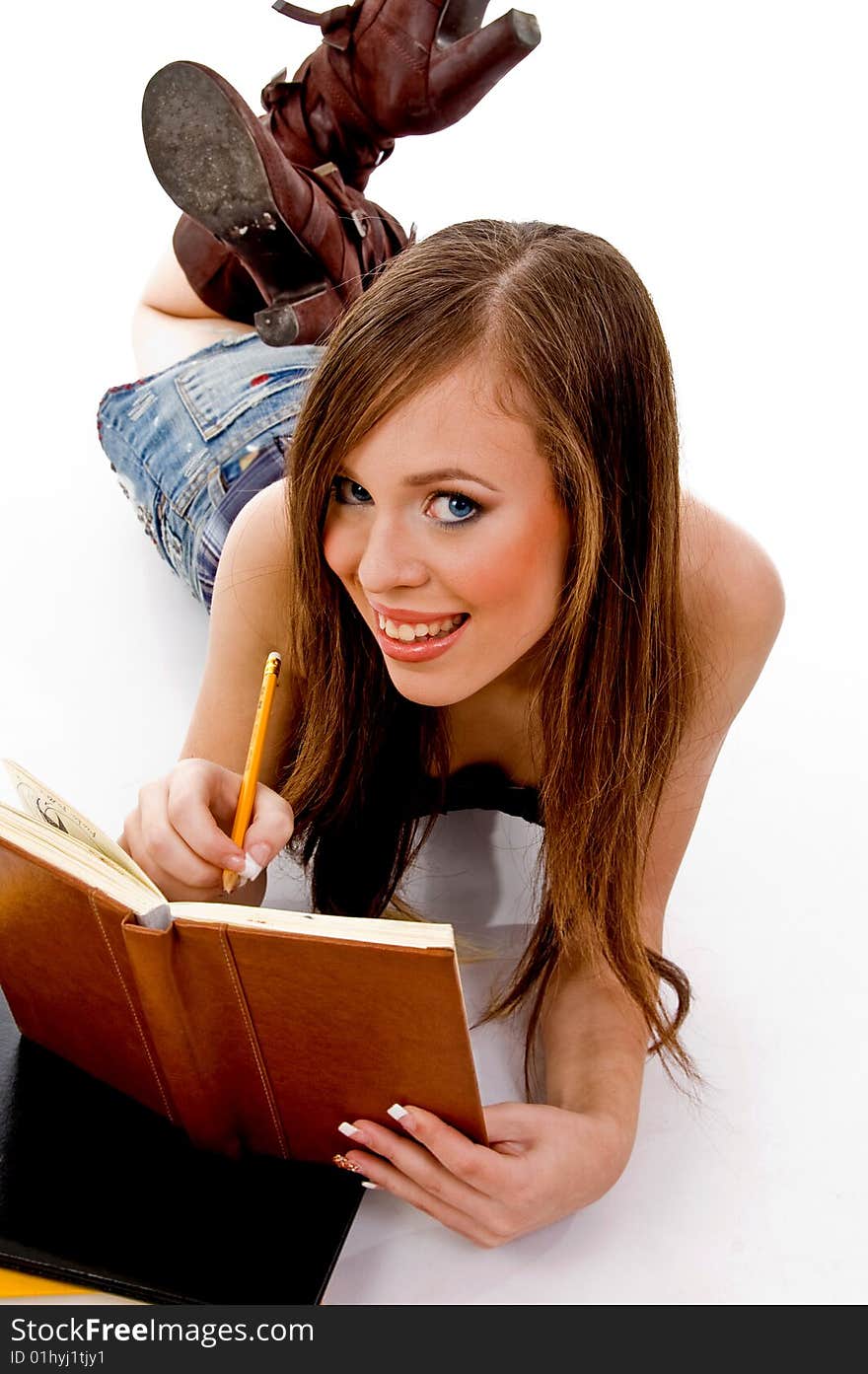 Top view of smiling woman studying on an isolated background