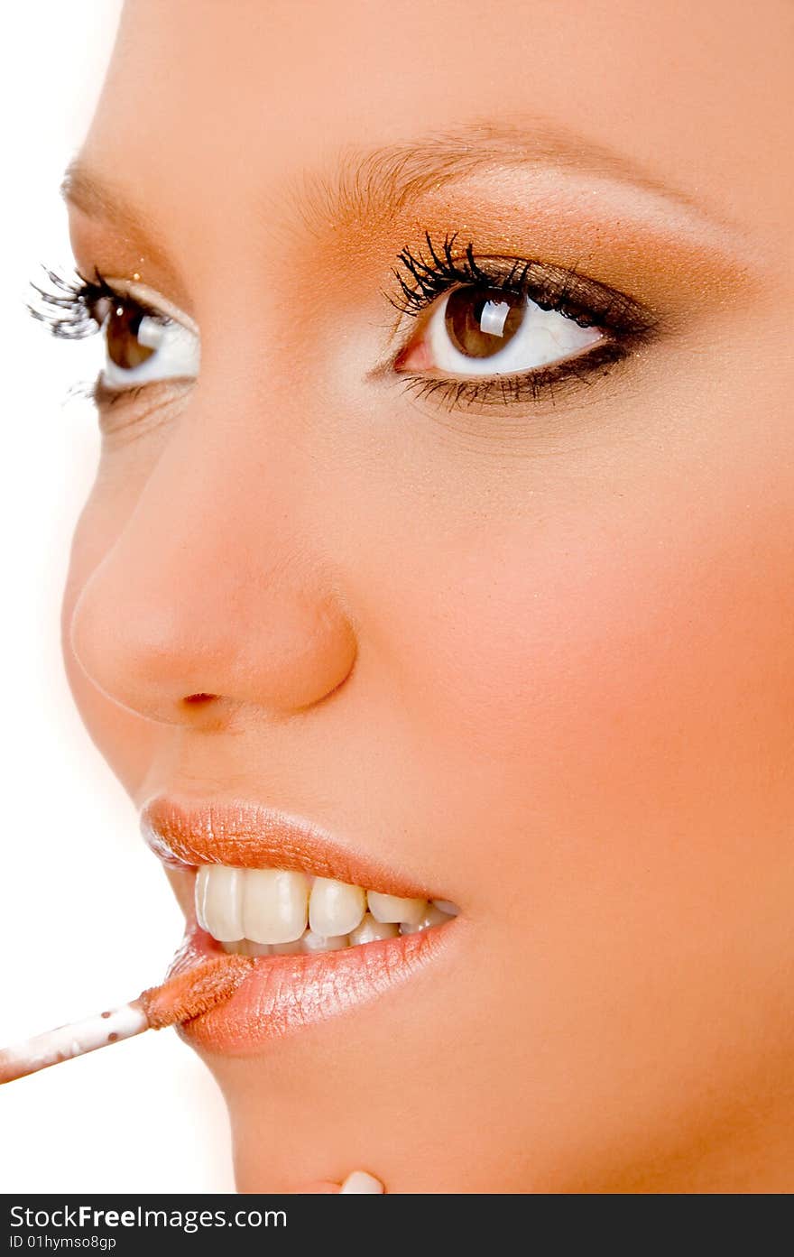 Close view of woman putting lipstick on an isolated white background