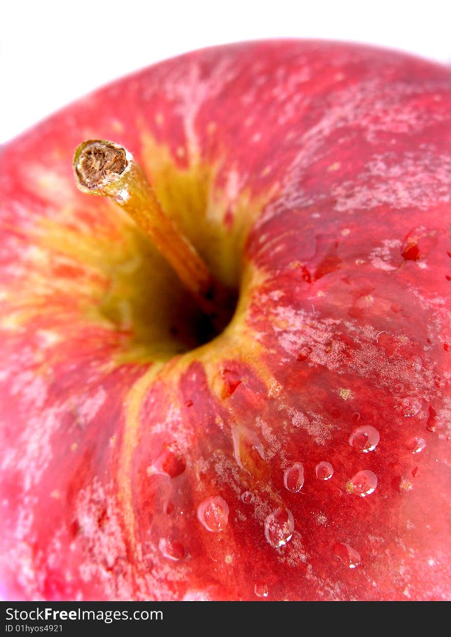 Detail of red apple with water droplets on the surface