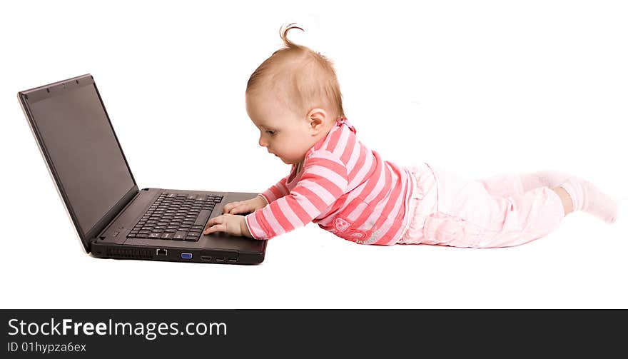 Little baby with laptop on white